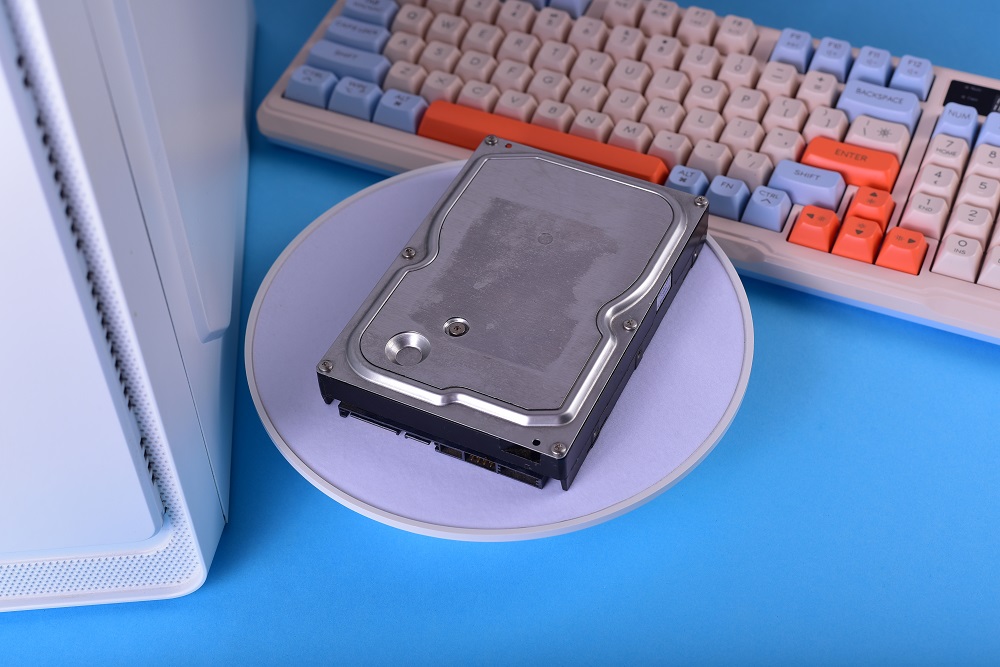 minimalist tech setup with old hard disk